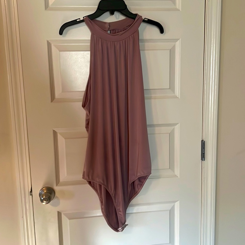 Blush colored 2 button snap crotch body suit. Worn once